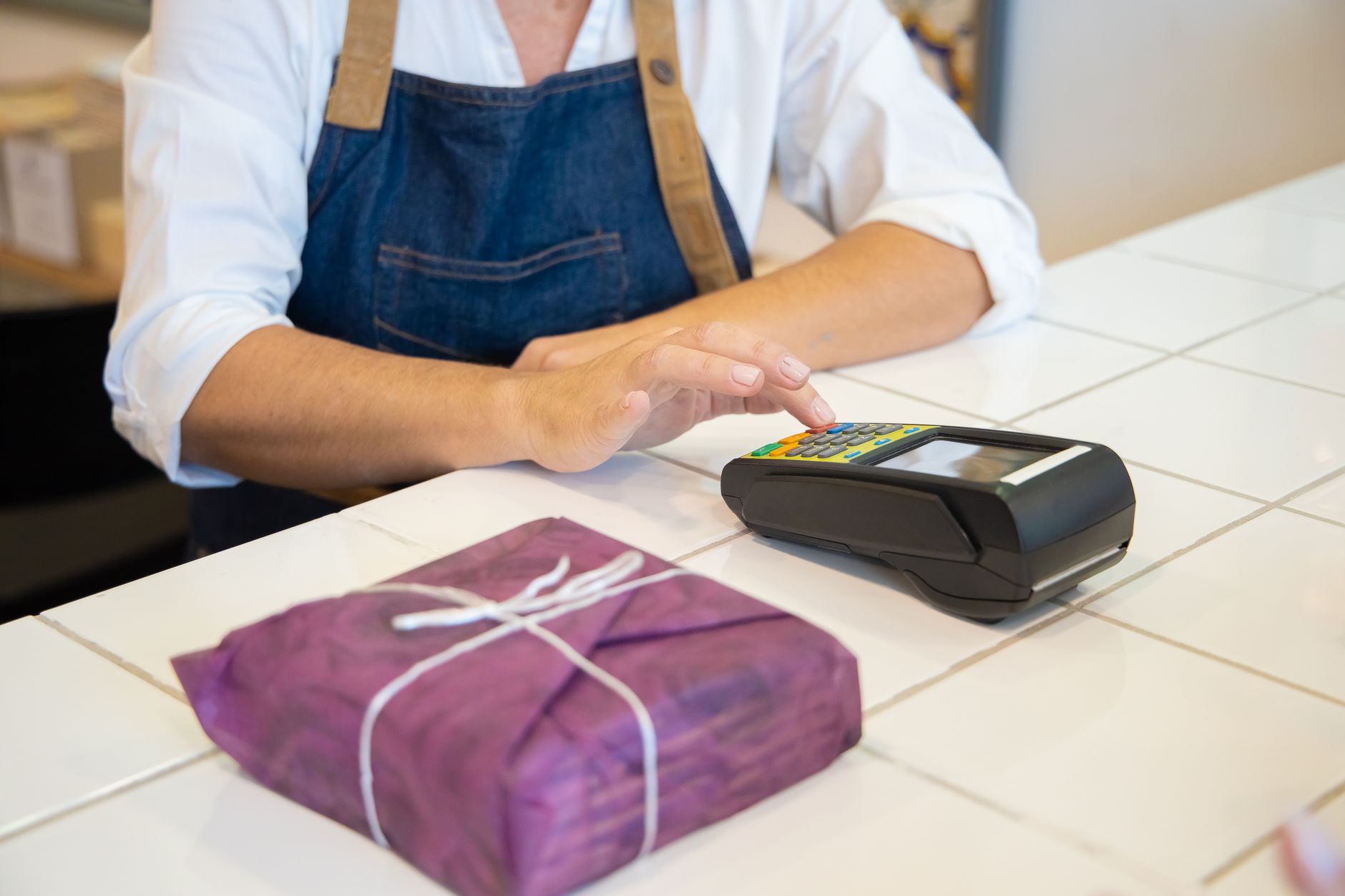 Retail counter with a point-of-sale terminal